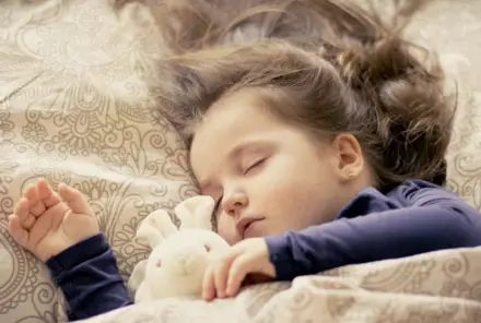 Kid Sleeping With Bunny